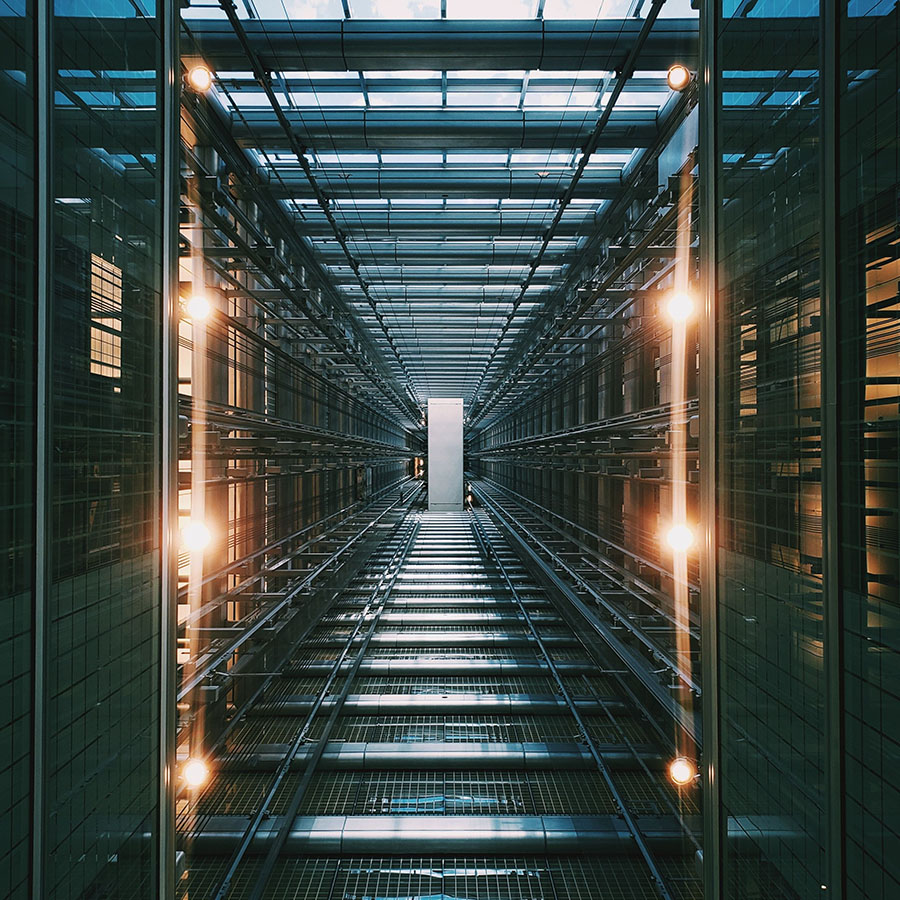 Vertical Shot Of An Illuminated Data Center Storage And Network Server Room